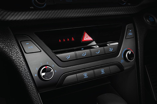 Power window control buttons on the armrest