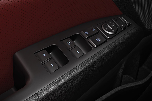 Power window control buttons on the armrest