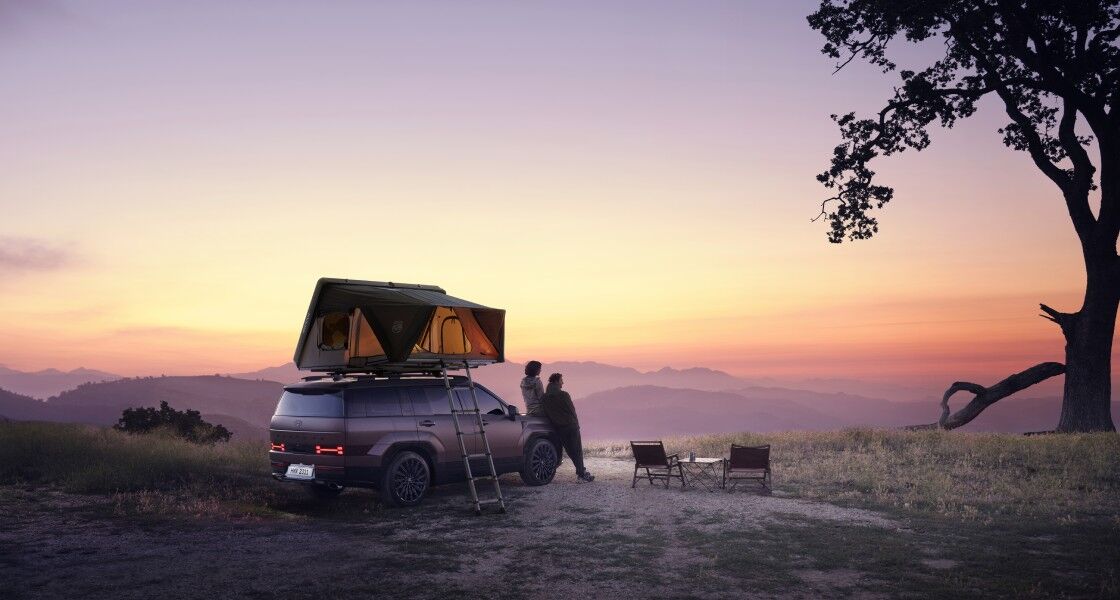 SANTA FE rear view parked next to the building