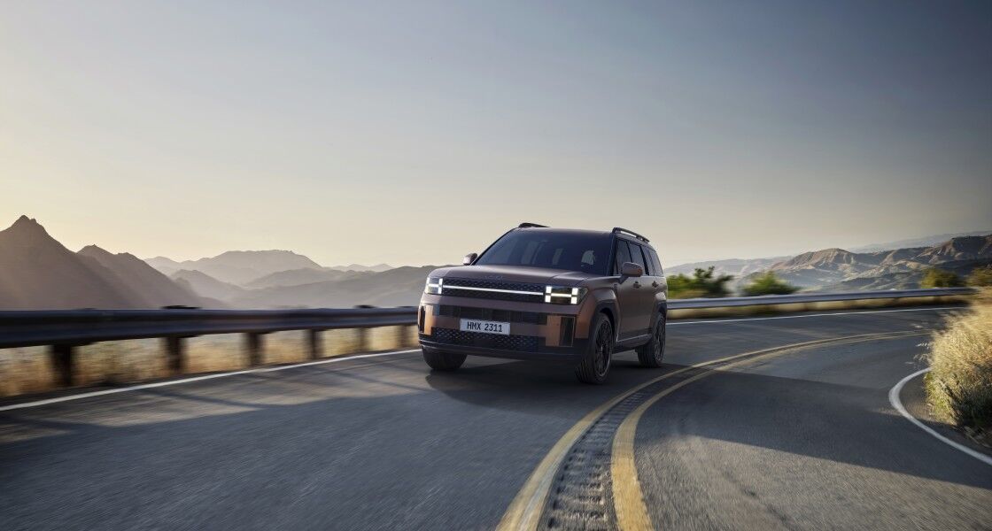 woman reading a book sitting in the front of SANTA FE